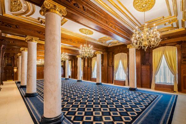 The 3,120-square-foot Willard Room is defined by its intricate, gold-hued columns, ceiling moldings, and lighting-medallion designs. These elements are juxtaposed with exquisite oak paneling; the room is spotlighted by brass and bronze chandeliers. The Willard Room is used for meetings and events for up to 350 guests, but in the past, it was established to accommodate a fine dining restaurant. (Courtesy of Willard InterContinental Washington)
