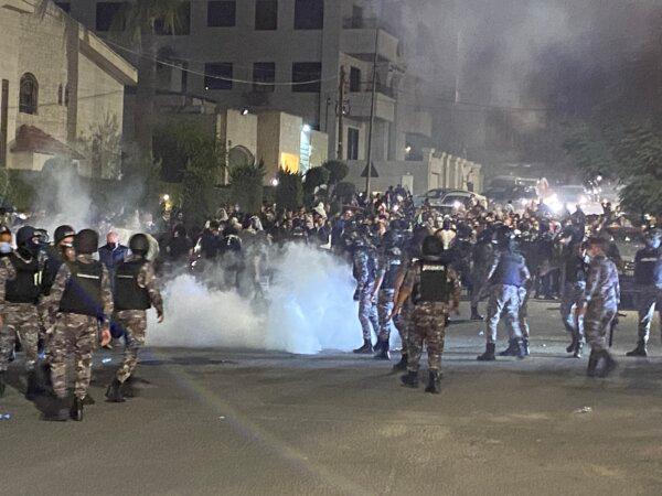 Jordanian security forces fire tear gas at demonstrators attempting to storm the Israeli embassy in the capital Amman on Oct. 17, 2023. (Mussa Hattar/AFP via Getty Images)