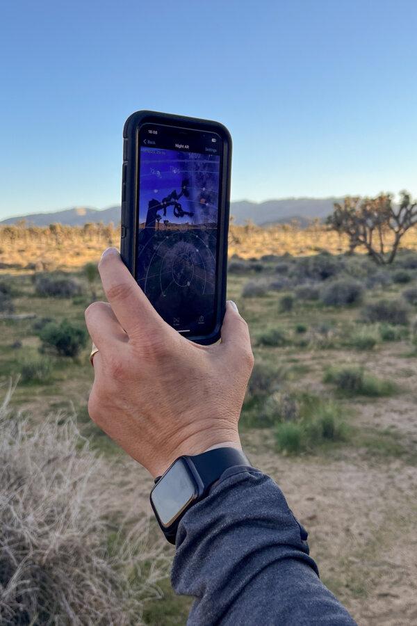 Jon Norris uses PhotoPills to see where the Milky Way will be in a few hours during a dark sky photography workshop, led by Desert Institute, on Sept. 16, 2023. (Julia Carmel/Los Angeles Times/TNS)