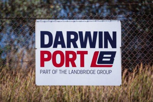 This picture taken on Aug. 28, 2023 shows a sign displayed on a fence surrounding the Darwin Port in the Northern Territory city of Darwin in Australia. (David Gray/AFP via Getty Images)