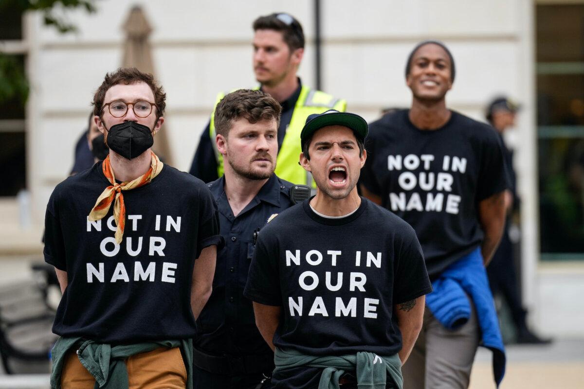 Demonstrators are detained by U.S. Capitol Police after they staged a sit-in inside the Cannon House Office Building to demand a cease-fire against Palestinians in Gaza on Independence Avenue near the U.S. Capitol in Washington on Oct. 18, 2023. (Drew Angerer/Getty Images)
