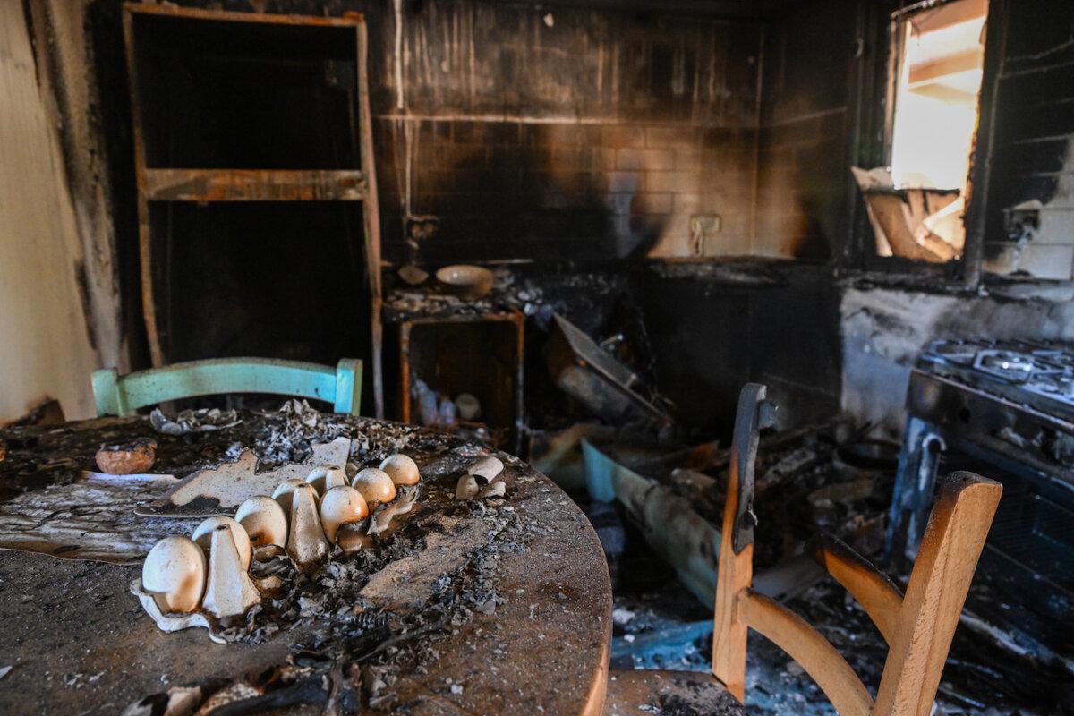 Charred eggs remain on a table after a house was completely burnt after Hamas terrorists attacked this kibbutz days earlier near the border of the Gaza Strip, in Nir Oz, Israel, on Oct. 19, 2023. (Alexi J. Rosenfeld/Getty Images)