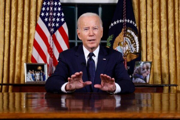 President Joe Biden addresses the nation on the conflict between Israel and Hamas and the Russian invasion of Ukraine from the Oval Office of the White House on Oct. 19, 2023. (Jonathan Ernst/Pool/AFP via Getty Images)