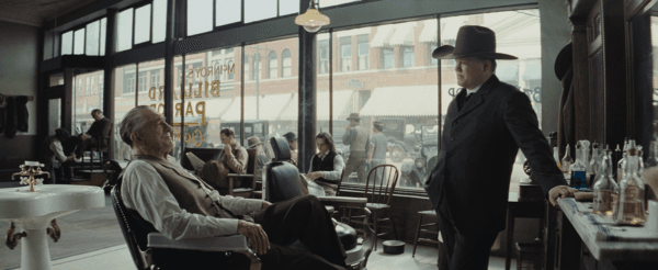 William King Hale (Robert De Niro, L) and Tom White (Jesse Plemons) discuss mysterious murder in a barbershop, in "Killers of the Flower Moon." (Melinda Sue Gordon/Apple TV+)