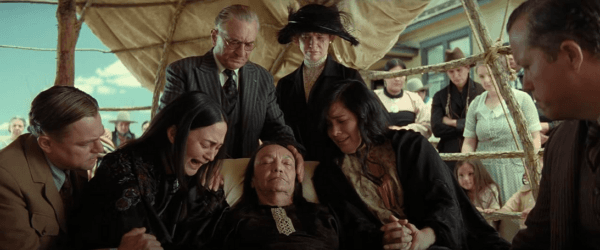 (L–R) Leonardo DiCaprio, Lily Gladstone, Robert De Niro, Tantoo Cardinal, Katherine Willis, Cara Jade Myers, and Jason Isbell in "Killers of the Flower Moon." (Melinda Sue Gordon/Apple TV+)