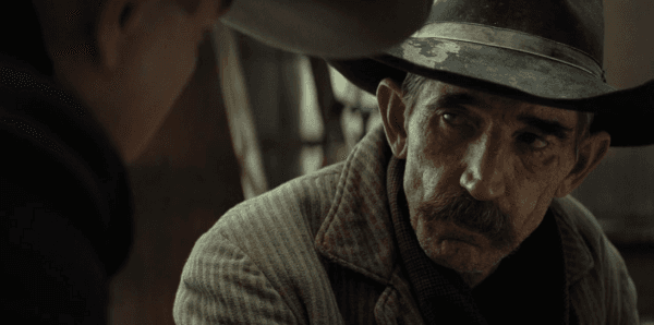 John Ramsey (Ty Mitchell), a lowlife hired gun tasked with killing Osage tribal members standing in the way of William Hale's plans, in "Killers of the Flower Moon." (Melinda Sue Gordon/Apple TV+)