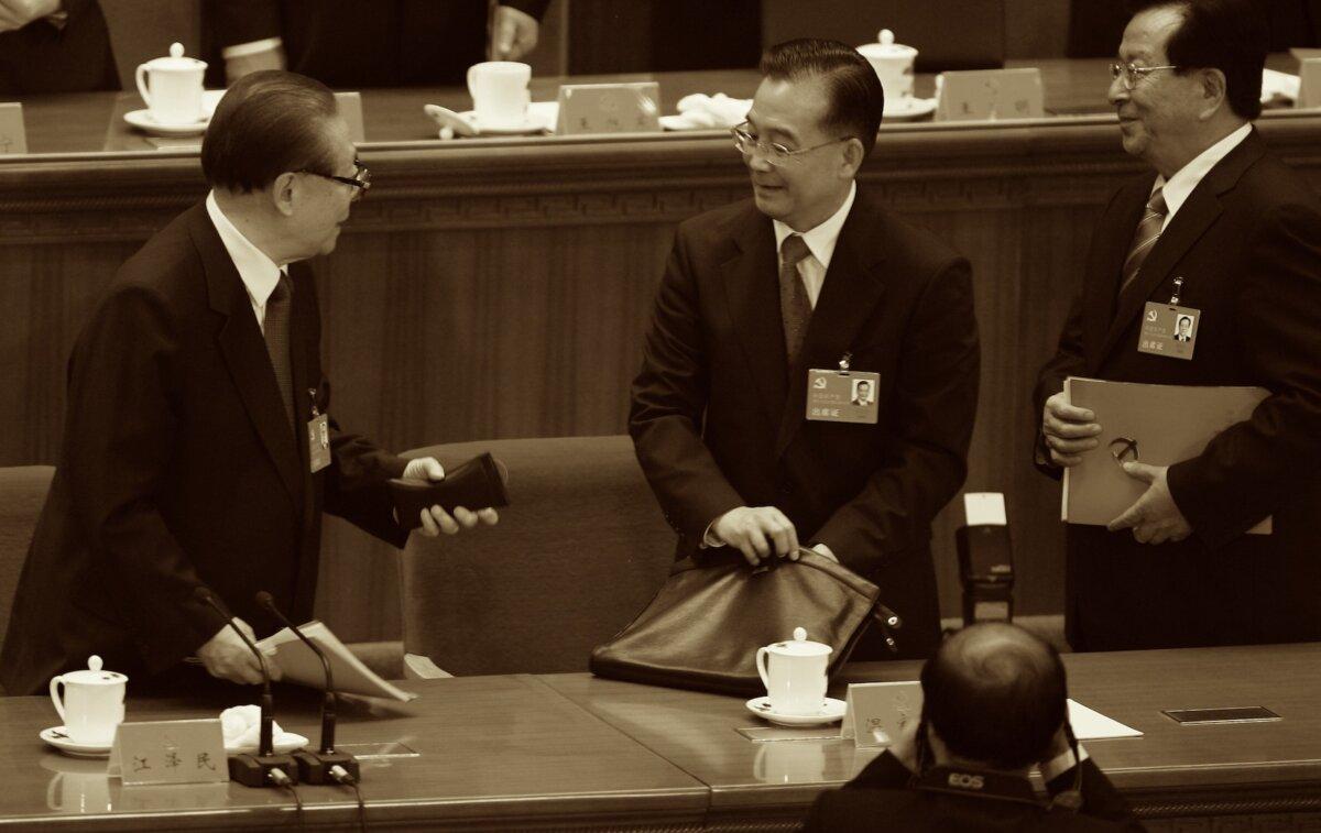 Chinese Vice President Zeng Qinghong (right), Premier Wen Jiabao (centre) and former President Jiang Zemin (left) leave the Great Hall after the Chinese Communist Party Congress at the Great Hall of the People in Beijing, China, on Oct. 21, 2007. (Feng Li/Getty Images)