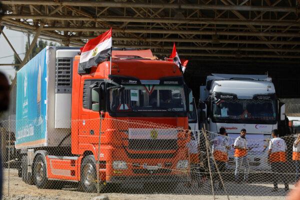 Trucks carrying aid arrive at the Palestinian side of the border with Egypt, in Rafah in the southern Gaza Strip, on Oct. 21, 2023. (Ibraheem Abu Mustafa/Reuters)
