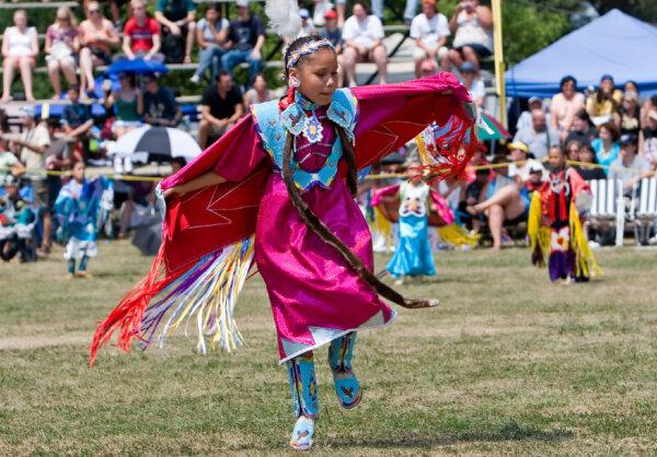 A Native American child dances at a tribal powwow. (Wdeon/Dreamstime)