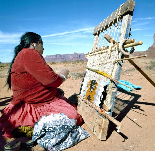 A Navajo woman weaves a traditional rug. (Robert Paul Van Beets/Dreamstime)