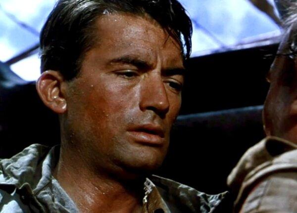 Squadron Leader Bill Forrester (Gregory Peck) is burning the candle at both ends, in “The Purple Plain.” (United Artists)