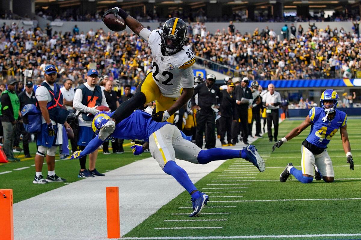 Pittsburgh Steelers running back Najee Harris, top, jumps over Los Angeles Rams safety Jordan Fuller during the second half of an NFL football game in Inglewood, Calif., on Oct. 22, 2023. (Gregory Bull/AP Photo)