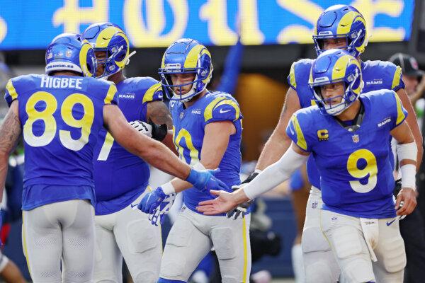 Matthew Stafford (9), Cooper Kupp (10), and Tyler Higbee (89) of the Los Angeles Rams celebrate a two point conversion during the third quarter against the Pittsburgh Steelers in Inglewood, Calif., on Oct. 22, 2023. (Harry How/Getty Images)