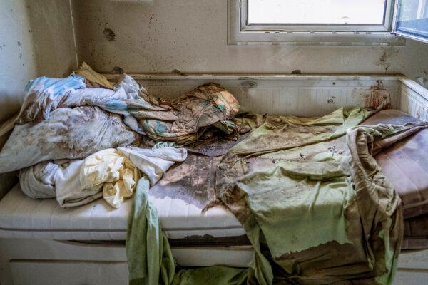 A child's bed stained with blood is among the damage caused by Hamas terrorists after they attacked Kibbutz Be'eri, Israel, on Oct. 20, 2023. (Dima Vazinovich/Middle East Images/AFP via Getty Images)