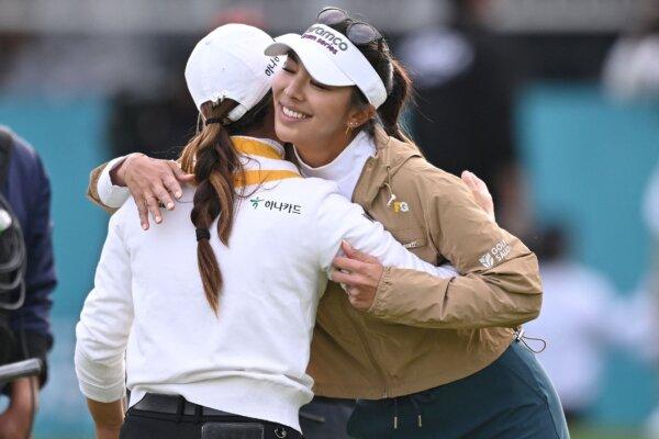 Australia's Minjee Lee (L) is hugged by USA's Alison Lee (R) as she celebrates her victory at the end of the BMW Ladies Championship golf tournament at Seowon Hills Country Club in Paju, South Korea, on Oct. 22, 2023. (Jung Yeon-je/AFP via Getty Images)