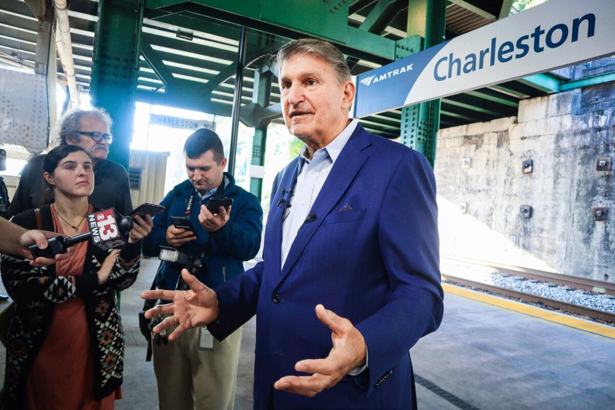 West Virginia Democrat Sen. Joe Manchin speaks with reporters outside the newly renovated Amtrak train station in Charleston, W.Va., on Oct. 12, 2023. (Leah Willingham/AP Photo)