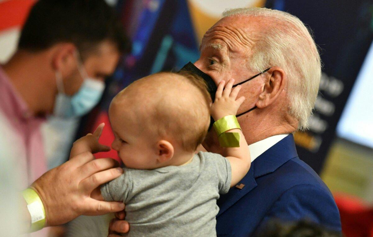 President Joe Biden greets children during a visit at a COVID-19 vaccination clinic at the Church of the Holy Communion in Washington on June 21, 2022. (Nicholas Kamm/AFP via Getty Images)