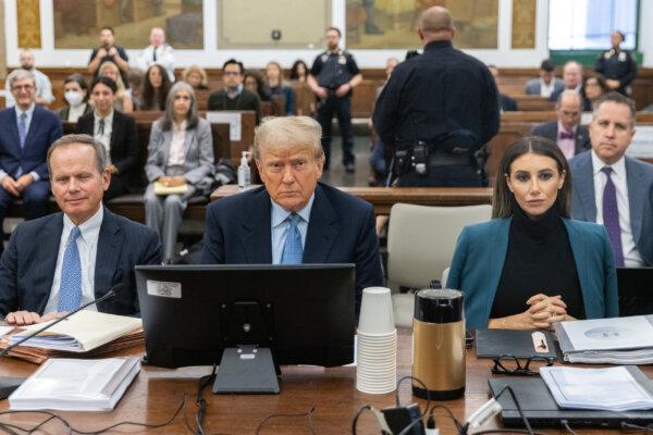  Former President Donald Trump (C) sits in the courtroom with attorneys Christopher Kise (L) and Alina Habba during his civil fraud trial at New York State Supreme Court in New York City on Oct. 18, 2023. (Jeenah Moon-Pool/Getty Images)