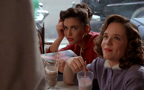 Lorraine Baines (Lea Thompson) is charmed by George McFly's desperate, chocolate-milk-fueled, courageous, and heart-warming declaration of love, in "Back to the Future." (Universal Pictures)