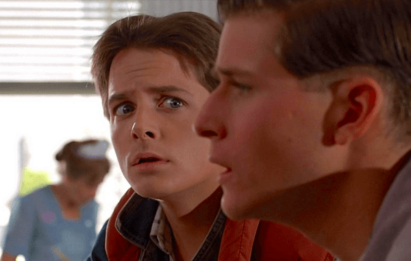 It slowly dawns on George McFly (Crispin Glover, R) that the new kid in town (Michael J. Fox) is staring at him, in "Back to the Future." (Universal Pictures)
