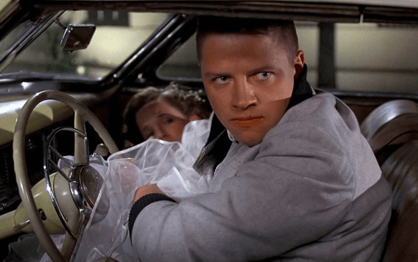 Big Bully Biff Tannen (Tom Wilson) being caught red-handed, trying to force himself on Lorraine Baines, in "Back to the Future." (Universal Pictures)