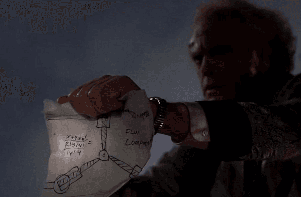 Dr. Emmett Brown (Christopher Lloyd) looks at the flux-capacitor diagram he made 30 years prior, in "Back to the Future." (Universal Pictures)