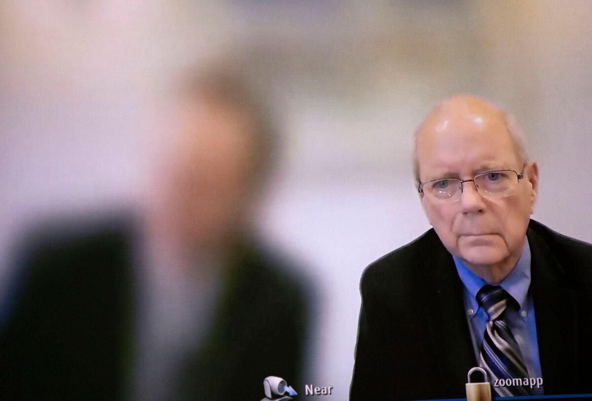 Seen on a television screen, James Renner is arraigned via Zoom in Ingham County District Court in Lansing, Mich., on Aug. 10, 2023. (Bill Pugliano/Getty Images)