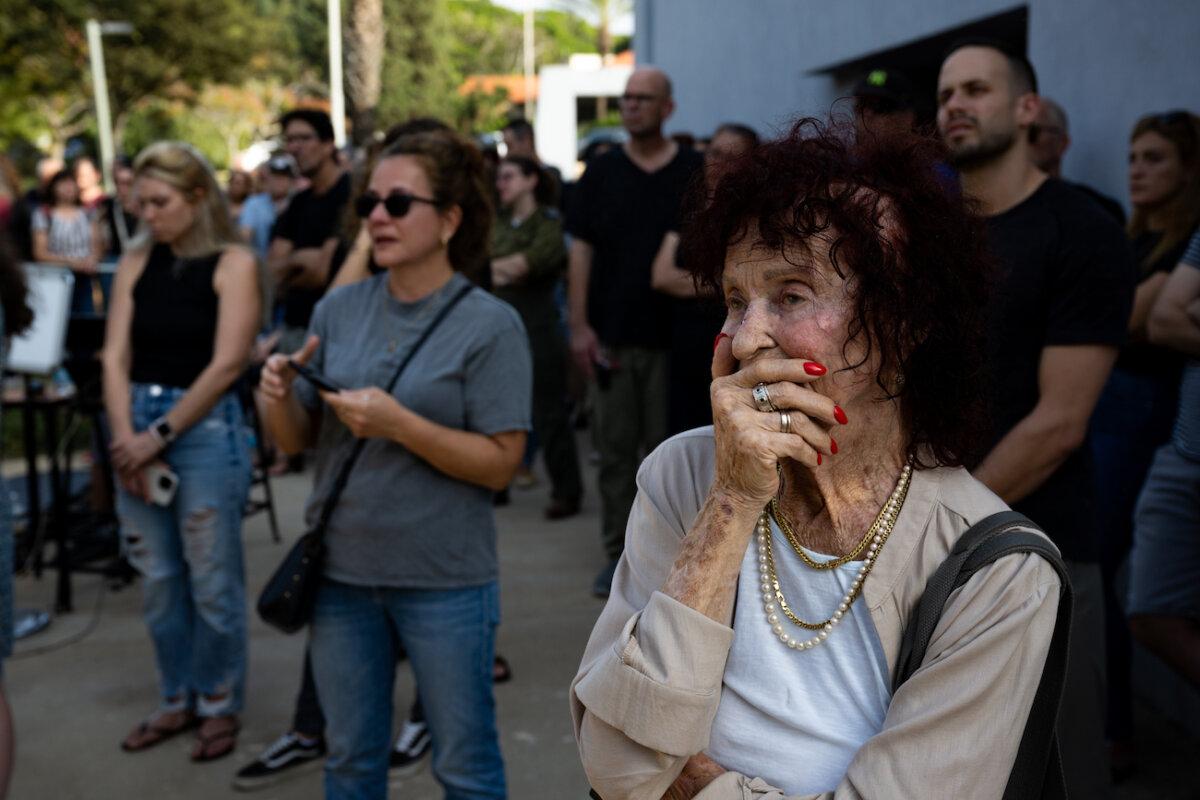 Mourners grieve for Cindy Flash, 67, and Igal Flash, 66, who were killed by Hamas terrorists on Oct. 7 when they attacked the Kfar Aza kibbutz, during a casketless ceremony in Shefayim, Israel, on Oct. 24, 2023. (Alexi J. Rosenfeld/Getty Images)