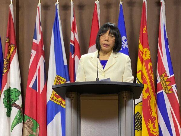 Grace Wollensak, representative of the Falun Dafa Association of Canada (FDAC), speaks at a press conference on Parliament Hill in Ottawa on Oct. 25, 2023. The FDAC released its first-ever report on the Chinese Communist Party's foreign interference in Canada and transnational repression of the spiritual practice Falun Dafa, also called Falun Gong.