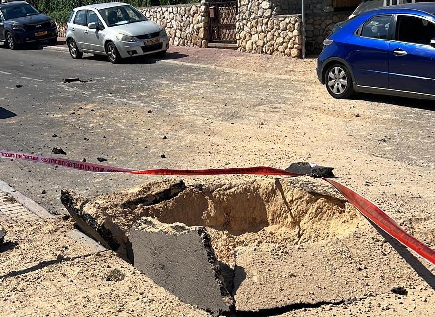 A Hamas rocket near Anna Levy's house in Ashkelon, Israel on Oct. 7, 2023 came within 10 meters of her car and home, spewing asphalt over her garden. (Courtesy of Anna Levy)