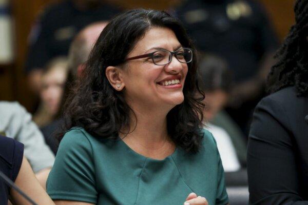 Rep. Rashida Tlaib (D-Mich.) smiles at a House hearing in front of the Committee on Oversight and Reform, in Washington on July 12, 2019. (Charlotte Cuthbertson/The Epoch Times)