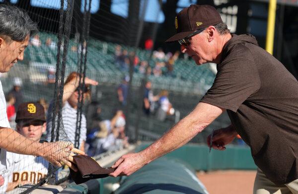 Then Manager Bob Melvin of the San Diego Padres grabs a hat to sign an autograph prior to facing the Atlanta Braves at Truist Park in Atlanta, Ga., on April 09, 2023. (Kevin C. Cox/Getty Images)