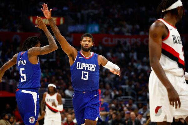 Bones Hyland (5) of the LA Clippers and Paul George (13) of the LA Clippers react against the Portland Trail Blazers in the second half in Los Angeles on Oct. 25, 2023. (Ronald Martinez/Getty Images)
