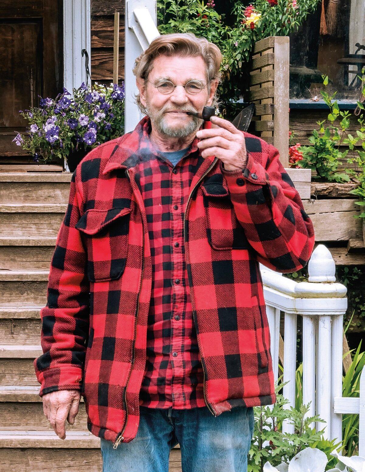 Eric Hollenbeck, in his signature lumberjack shirt, stands in front of the Blue Ox Millworks office in Eureka, Calif. (Maria Coulson)