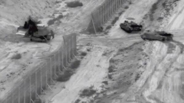 Israeli armoured vehicles take part in an operation, at a location given as the northern Gaza Strip in this still image taken from handout video released on Oct. 26, 2023. (Israel Defense Forces/Handout via Reuters)