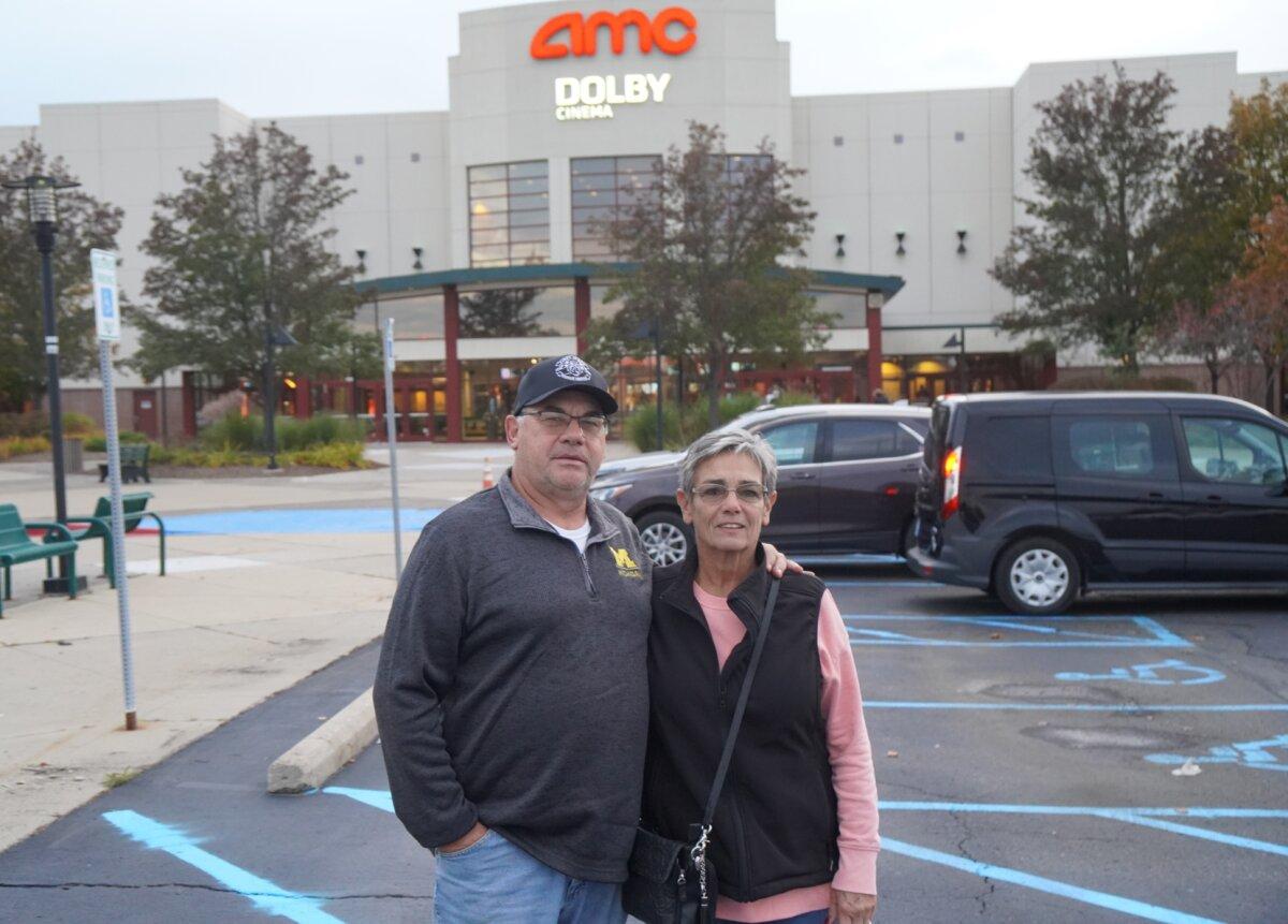 A couple attends the premiere of 'Police State' in Sterling Heights, Mich. on Oct. 23, 2023. (Steven Kovac/Epoch Times)