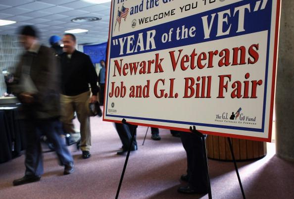 Veterans arrive to meet potential employers at a job fair for former servicemen and women on the campus of Rutgers University in 2012. (John Moore/Getty Images)