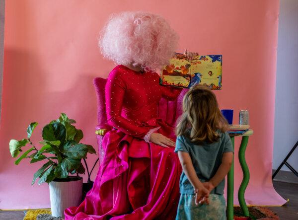 A child listens as a drag queen reads a book during a drag time story hour in a file photo in Austin, Texas, on Aug. 26, 2023. (Brandon Bell/Getty Images)