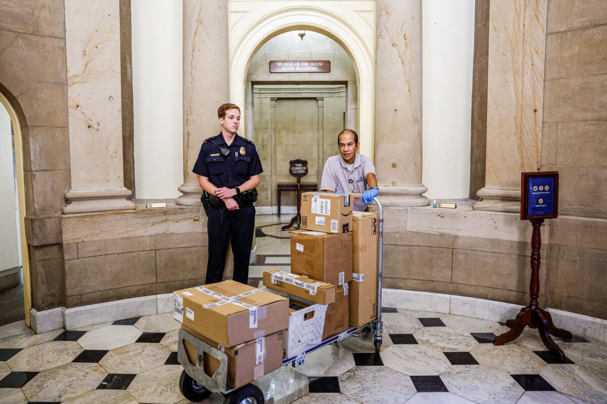 A delivery man leaves the House speaker's office at the U.S. Capitol in Washington on Oct. 5, 2023. After Rep. Kevin McCarthy (R-Calif.) was ousted from the speakership, nine representatives stepped forward to run to replace him. (Anna Moneymaker/Getty Images)