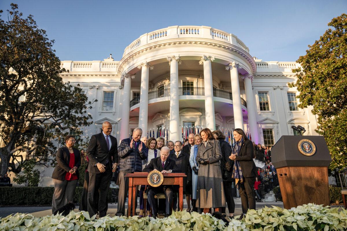 President Joe Biden signs the Respect for Marriage Act on the South Lawn of the White House on Dec. 13, 2022. (Drew Angerer/Getty Images)