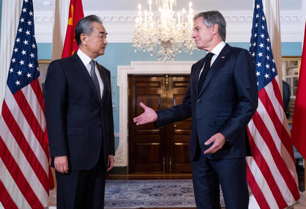 Secretary of State Antony Blinken speaks with Chinese Foreign Minister Wang Yi prior to meetings at the State Department in Washington on Oct. 26, 2023. (Saul Loeb/AFP via Getty Images)