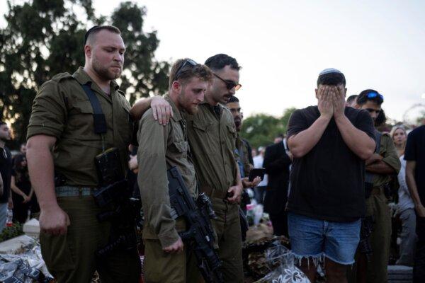 Mourners attend the funeral of the Israeli man Sagiv Ben Svi, killed by Hamas terrorists while attending a music festival, at a cemetery in Holon, central Israel, on Oct. 26, 2023. (Petros Giannakouris/AP)