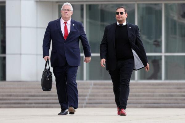 Rep. George Santos (R-N.Y.) walks out of a federal courthouse in Long Island with his lawyer Joe Murray (L) in Central Islip, N.Y., on Oct. 27, 2023. (Spencer Platt/Getty Images)