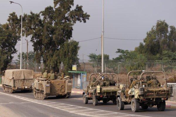 Israeli tanks and troops move near the border with Gaza in Sderot, Israel, on Oct. 28, 2023. (Dan Kitwood/Getty Images)