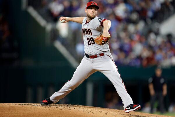 Merrill Kelly (29) of the Arizona Diamondbacks pitches in the first inning against the Texas Rangers during Game Two of the World Series at Globe Life Field in Arlington, Texas, on Oct. 28, 2023. (Carmen Mandato/Getty Images)