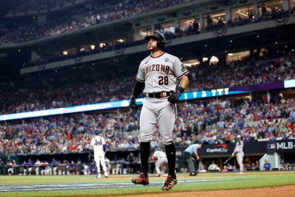 Tommy Pham (28) of the Arizona Diamondbacks celebrates after scoring a run in the eighth inning against the Texas Rangers during Game Two of the World Series at Globe Life Field in Arlington, Texas, on Oct. 28, 2023. (Carmen Mandato/Getty Images)