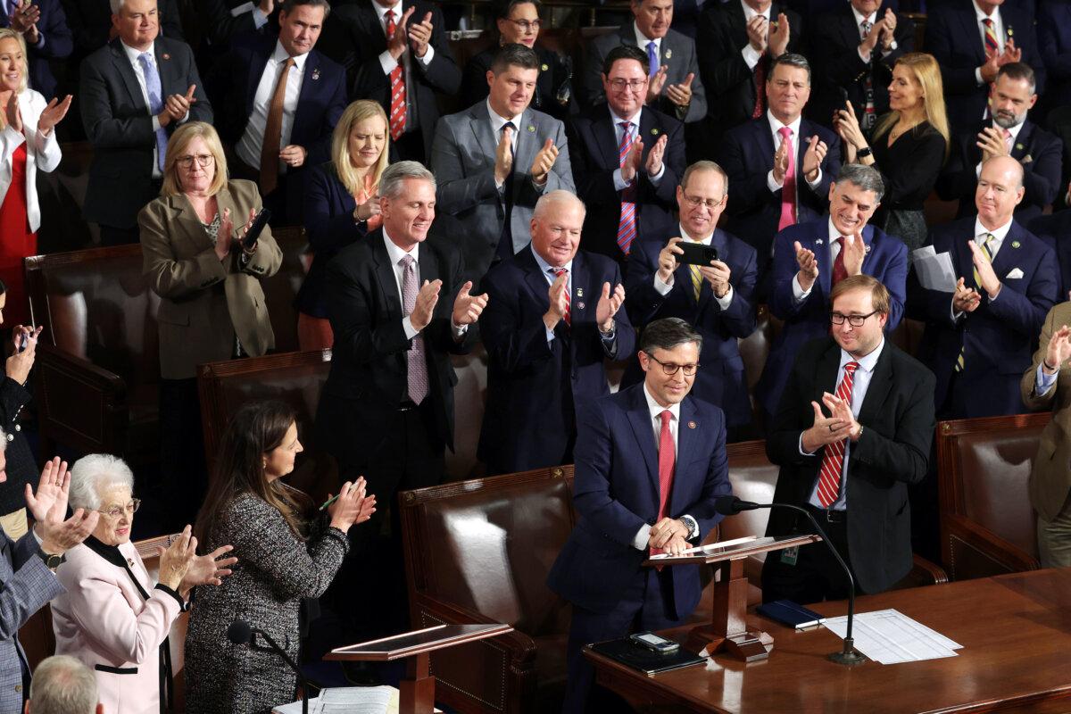 House Republicans applaud as Rep. Mike Johnson (R-La.) (C) is elected the new speaker of the House at the U.S. Capitol in Washington on Oct. 25, 2023. After a contentious nominating period that saw four candidates over a three-week period, Mr. Johnson was voted in to succeed former Speaker Kevin McCarthy (R-Calif.). (Alex Wong/Getty Images)
