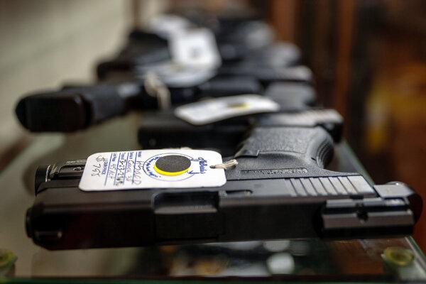 Semi-automatic firearms are displayed for sale on a shelf at the McBride Guns Inc. store on Aug. 25, 2023, in Austin, Texas. The Biden administration plans to revoke licenses from hundreds of firearms dealers, provoking disagreements among gun-store owners and law-enforcement veterans around the country. (Brandon Bell/Getty Images)