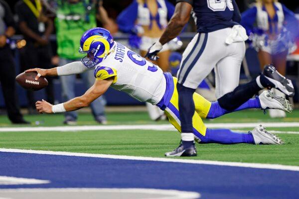 Matthew Stafford (9) of the Los Angeles Rams scores a two-point conversion in the third quarter of a game against the Dallas Cowboys in Arlington, Texas, on Oct. 29, 2023. (Ron Jenkins/Getty Images)