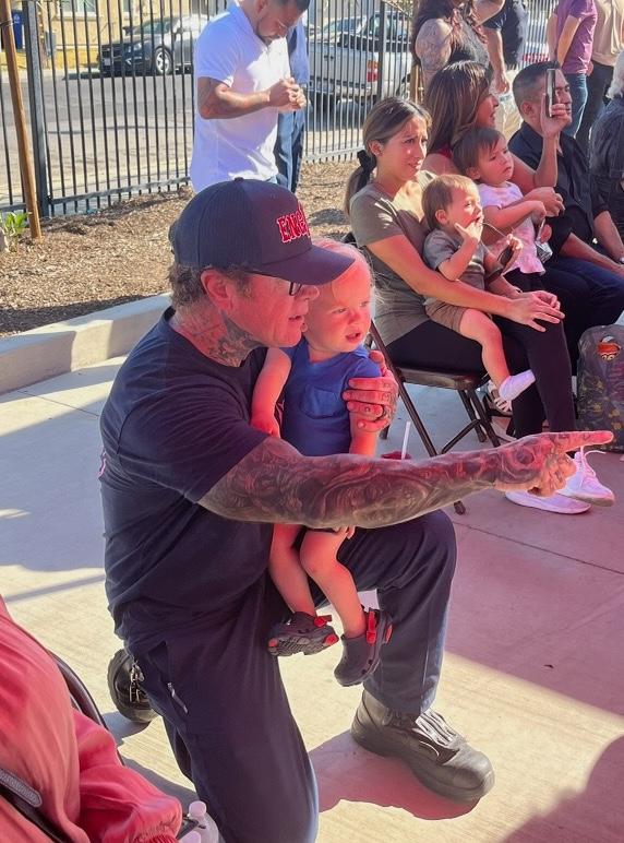 Capt. Thompson with his child. (Courtesy of Los Banos Fire Department)